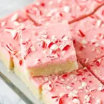 Delicious peppermint sugar cookie bars displayed on a festive plate.