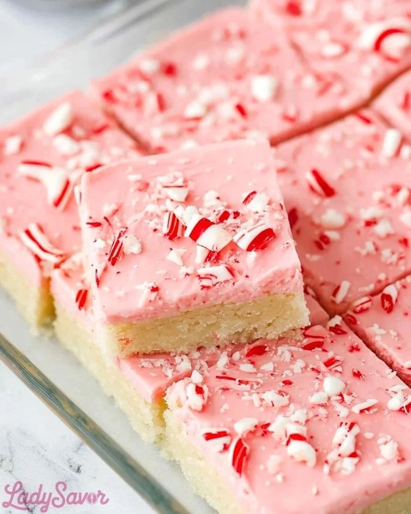 Delicious peppermint sugar cookie bars displayed on a festive plate.